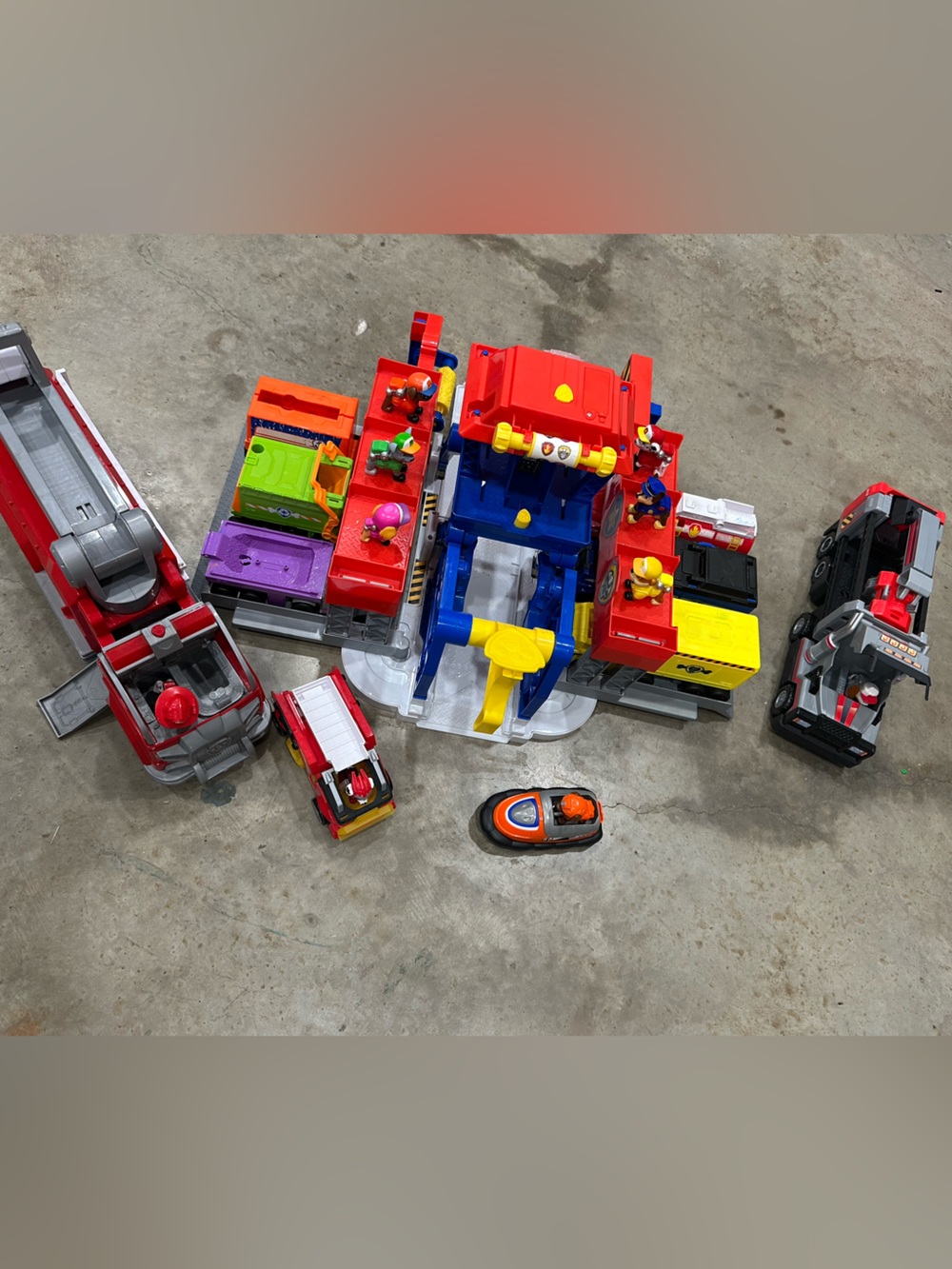 Paw patrol toy with all the trucks and paws on them.
